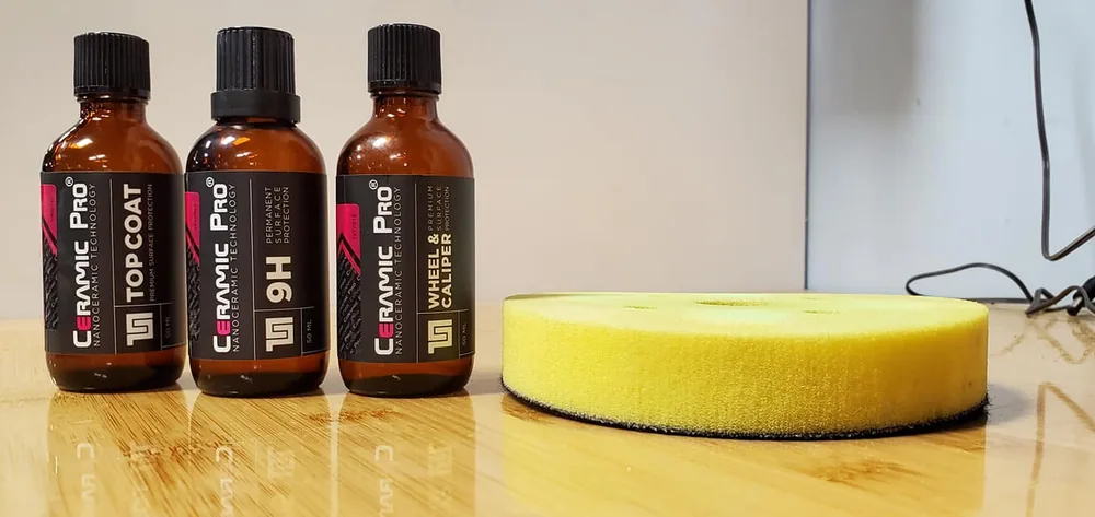 Ceramic Pro Top Coat, 9H, and Wheel and Caliper coating bottles with an applicator